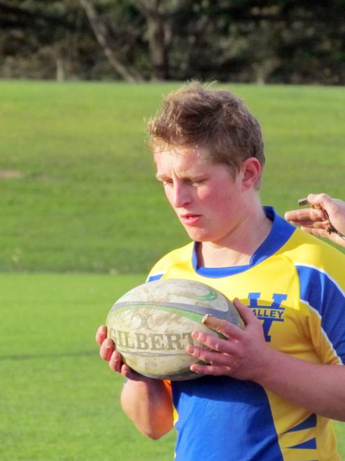 Valley halfback Zane Gard prepares to feed a scrum during the Citizens Shield game against...