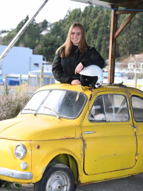 Nikita Gibson stands in the family's beloved Fiat Bambina car. Photo: Stephen Jaquiery