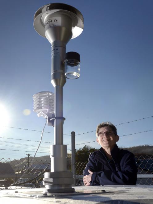 Otago Regional Council environmental scientist Deborah Mills surveys new air monitoring equipment in Albany St. Photo: Gerard O'Brien