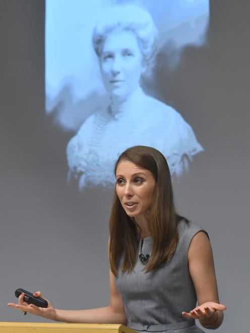 Writer, musician and activist Lizzie Marvelly, in front of a photo of New Zealand suffragette Kate Sheppard, delivers the 2018 Michael King memorial lecture at the University of Otago last night. Photo: Gregor Richardson