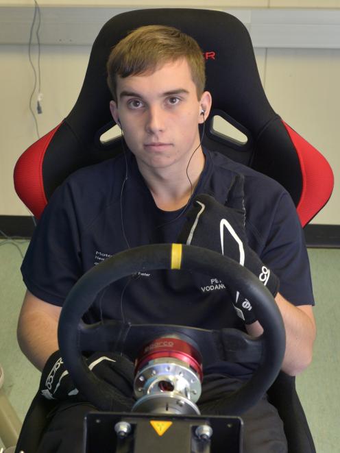 Peter Vodanovich (19) trains in the driving simulator at the School of Physical Education during...