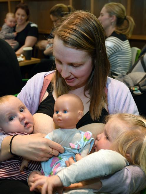 Beki Forbes feeds her children Addison (2 years) and a more reluctant Clarabelle (6 months) at a breastfeeding morning tea at the Plaza Cafe in Dunedin yesterday. Photo: Stephen Jaquiery
