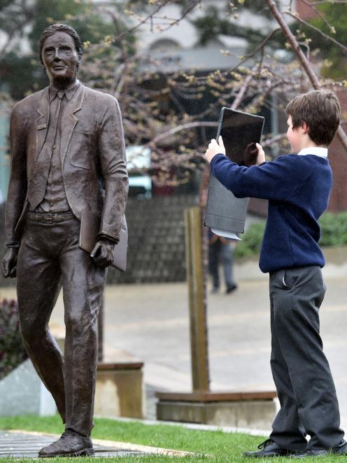 John McGlashan pupil Esteban Garcia (11) captures an image of the sculpture, which was created...
