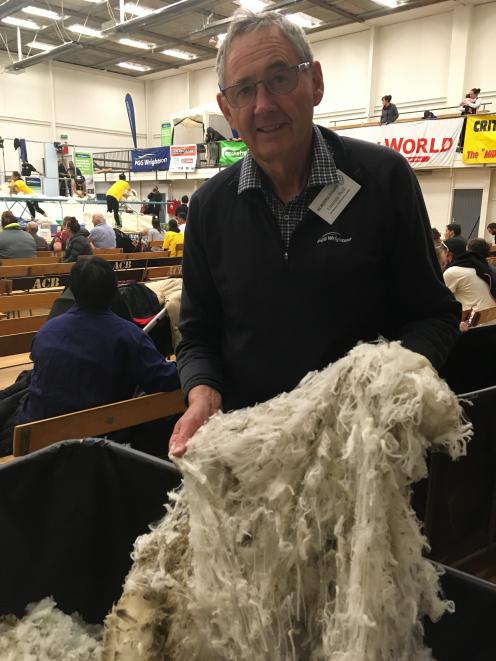 New Zealand Merino Shearing Championships committee member Graeme Bell looks over some of the...