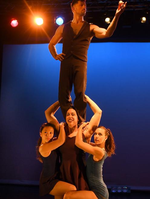 Casus Circus performer Sarah McDougall holds up Mayu Moto (left), Shannon Vitali (right) and...
