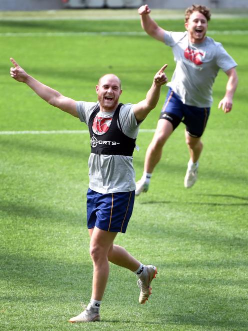  Otago centre Matt Faddes and winger Mitchell Scott (behind) celebrate winning a game during...