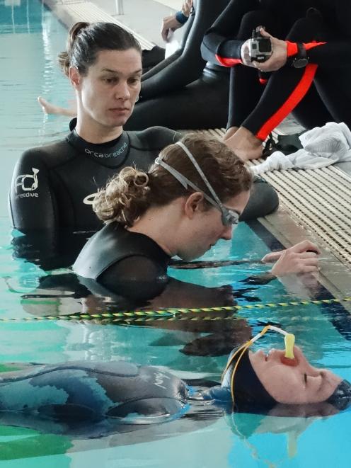 Preparing for their static apnea breath holds are (bottom) Gemma O’Brien, of Northland, and...