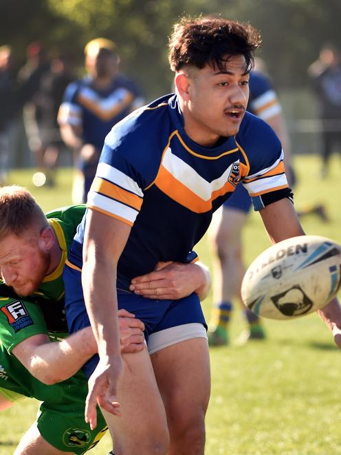 Tama Apineru, of the Otago Whalers, is tackled by David Hall, of the Aoraki Eels, during the...