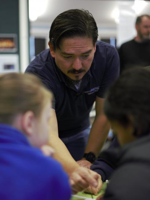 Niwa air quality scientist Gustavo Olivares shows Alexandra Primary School pupils the inner...