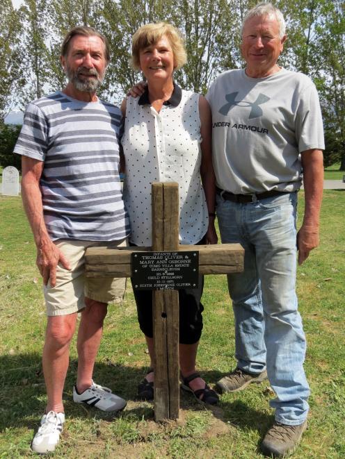 In the Alexandra Cemetery with the wooden cross marking the graves of two infants who died in...