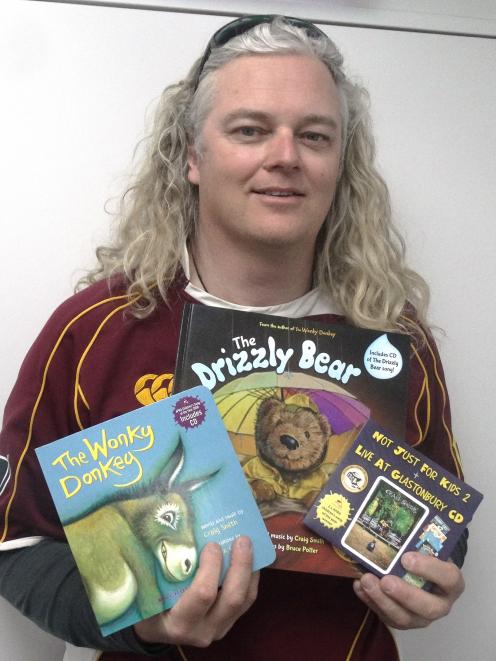 Kiwi author Craig Smith with his popular children's book, The Wonky Donkey, and his new book, The...