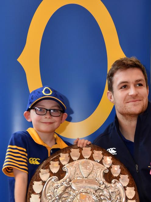 Hayden Symister (8), of Dunedin, and Otago captain Michael Collins with the Ranfurly Shield at...