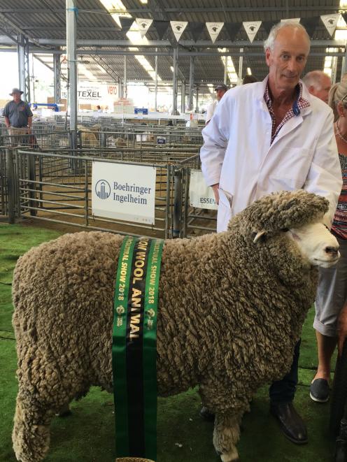 Jim Sidey (left), of Waikari, was pleased to win supreme champion wool sheep. Photo: David Hill