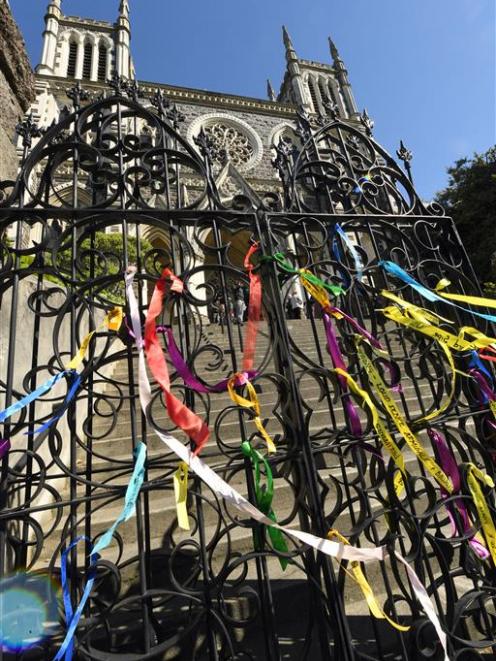 Ribbons of remembrance from around the world were tied on the gates of St Joseph's Cathedral in...