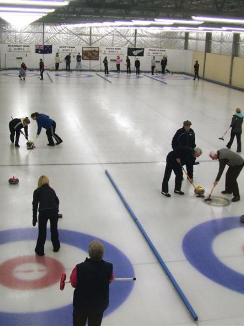 Two curling matches are played on the Maniototo indoor rink at Naseby. Image from ODT files.