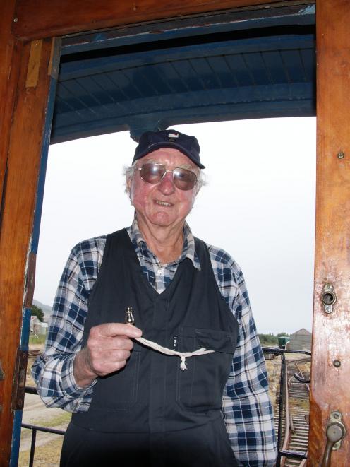 Whistle-blower George Gardner with his historic whistle on the train at Mandeville. Photo: Alina...