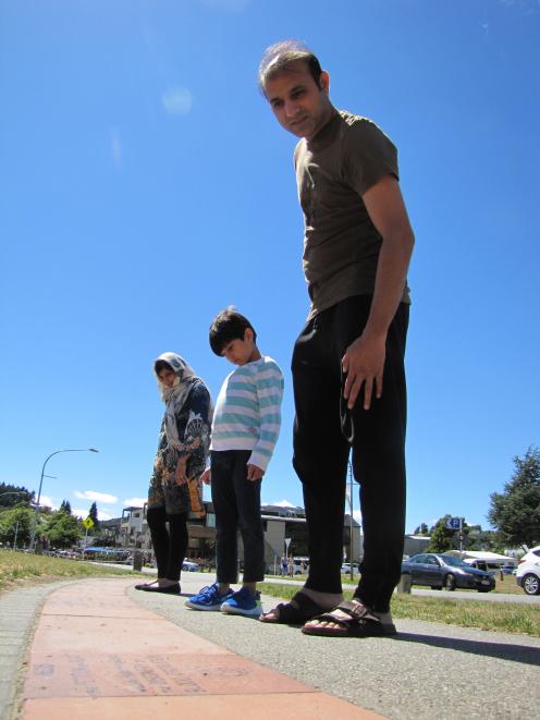 Asma, Qasim (5) and Mustafa Khan, of Auckland, look for significant Pakistan dates in Wanaka's...