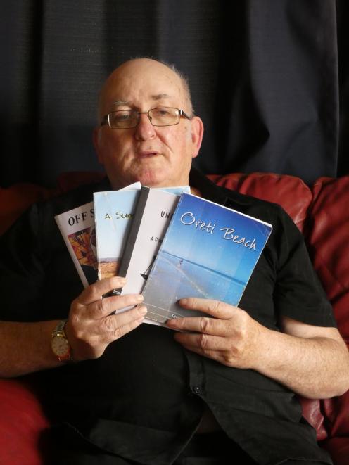 Invercargill poet Terry Lynch with some of his published books of poetry. Mr Lynch uses his battles with mental health problems to teach others to use artistic expression to cope with their own mental health issues. Photo: Ben Waterworth