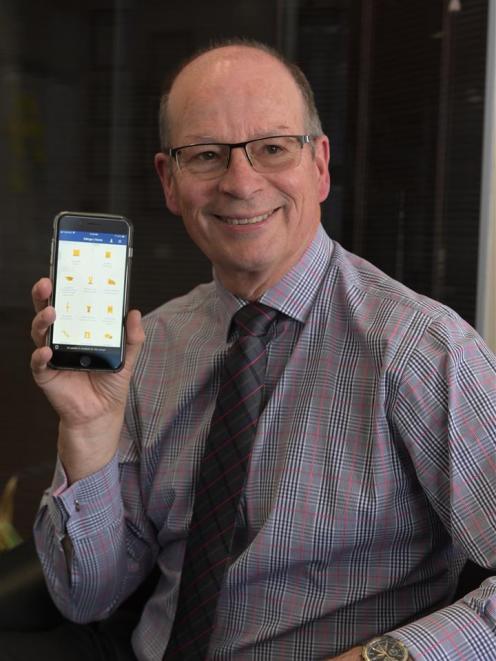 University of Otago information services director Mike Harte uses the new Otago App, helping...