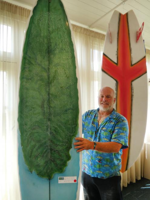 Riverton artist Wayne Hill poses with some of his work at his latest exhibition. PHOTO: BEN...