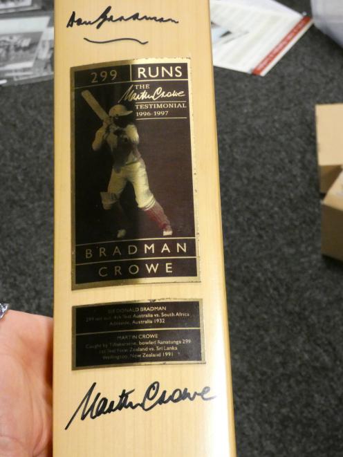 A bat signed by Martin Crowe and Sir Donald Bradman. PHOTOS: BEN WATERWORTH