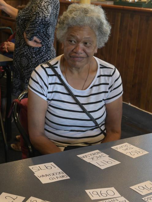 Makarita Huihui watches as her friends debate the options in a trivia game played at the Senior...