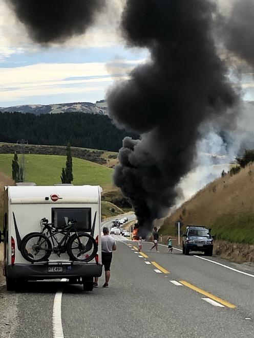 Victoria Lund's car fully ablaze near Raes Junction last Saturday. Photo: Liz Christensen
