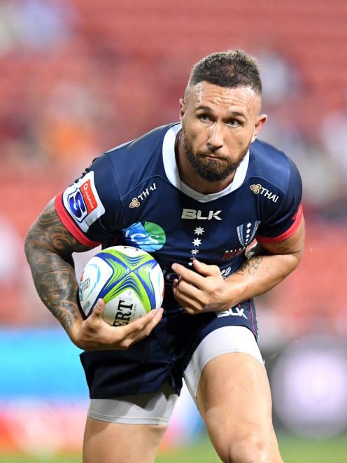 Quade Cooper runs the ball up for the Rebels against the Reds. Photo: Getty