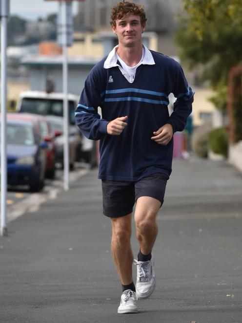 Sam Bremer runs in Dunedin yesterday during a work break as he prepares to head to Christchurch for the national track  and field championships.