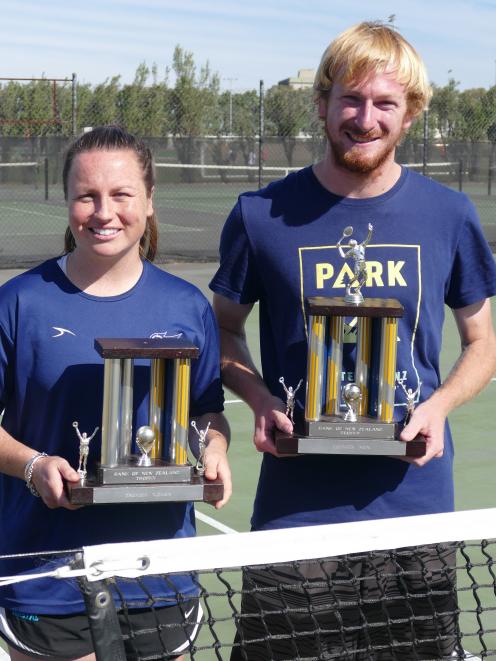 Libby Scott and Ryan Eggers hold the player of the year trophies they received at the Otago...