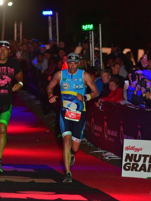 Brighton triathlete Scott Weatherall is nearing the end of the Ironman race in Taupo on Saturday....