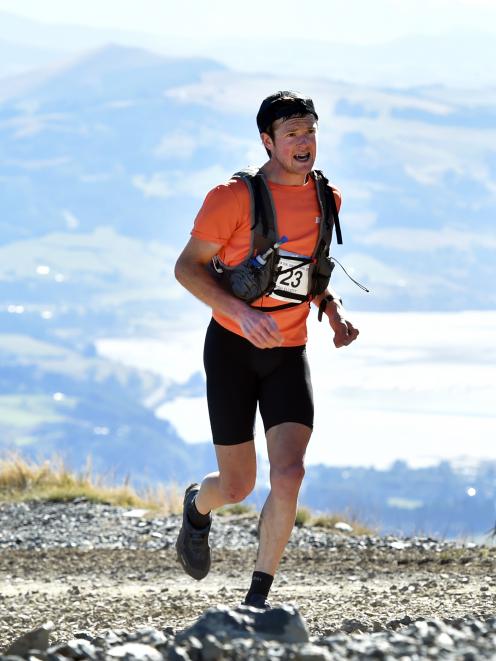 Hamish Elliott atop Mount Cargill yesterday during his Three Peaks Mountain Race win. Inset:...