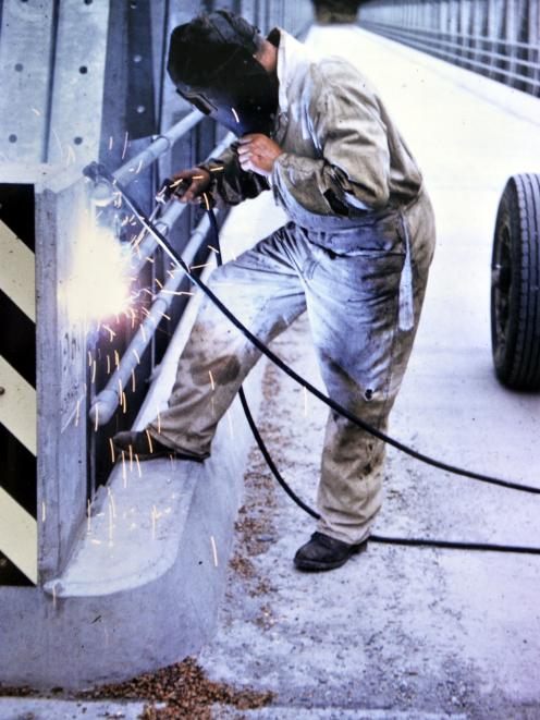 Jack Seyb welds a bridge at Pleasant Flat.

