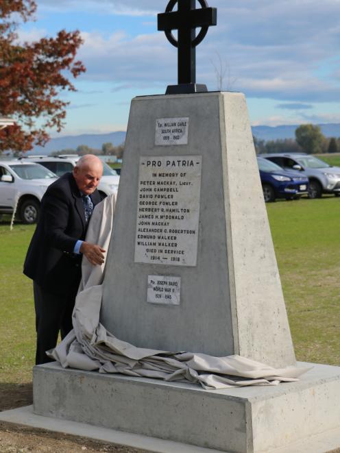 Alan Fowler, of Wendon, unveils the new Wendon War Memorial, north of Gore, yesterday. The...