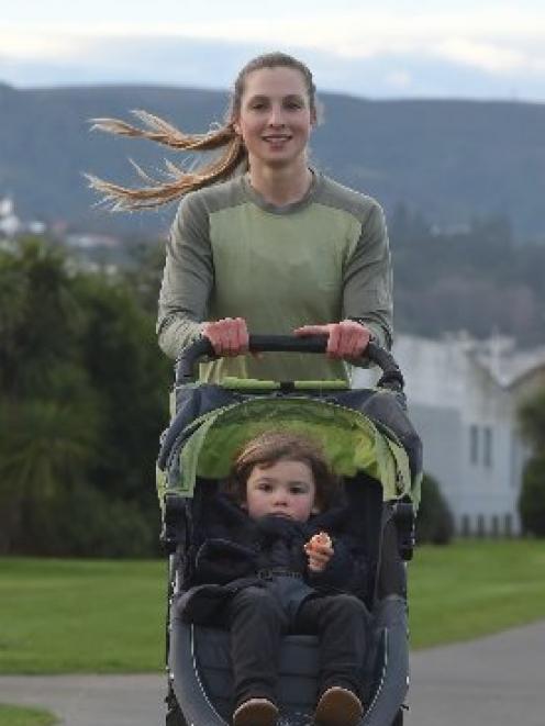 In transit . . . Sharon Lequeux and her daughter, Poppy (2), on the way home from work along...