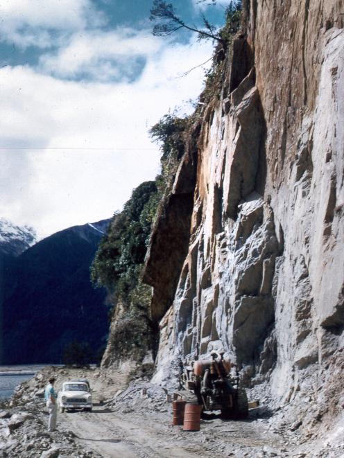 Workers had to cut through rock and cliff face to create the road.