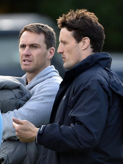 Ben Smith (left) and Glenn Dickson watch the first XV match between King’s High School and Otago...