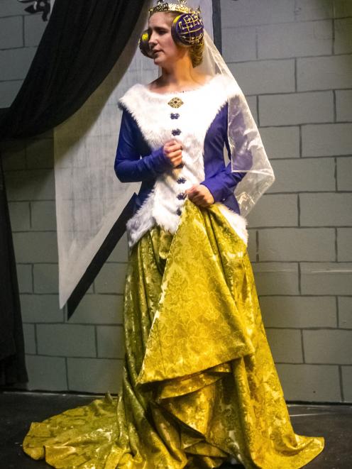The Queen, played by Beth Lochhead, in her costume of found fabrics.