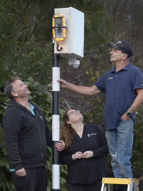 BFW Innovations business partners Grant Woolford (left) and Vicky Steel, with Larry Burns and the crossing sensor he has invented. Photo: Gerard O'Brien