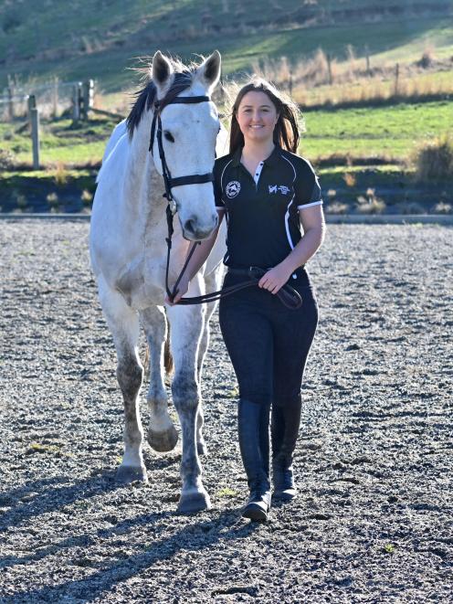 Outram rider Hollie Kooman gets in some training with her horse Silver Gamble in Outram yesterday. Kooman will represent New Zealand at the Nation's Cup in Hong Kong next month. Photo: Linda Robertson