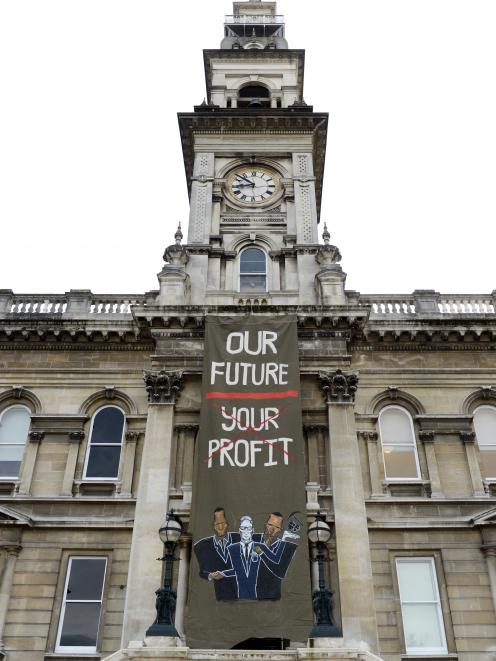 A large anti-mining banner was unfurled down the front of the Municipal Chambers. Photo: Gerrard...