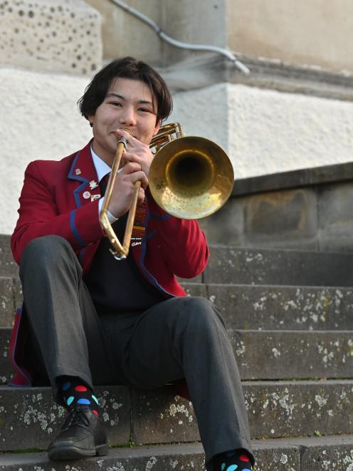 Sebastian Hook plays the trombone he will be using in the National Secondary Schools' Brass Band....