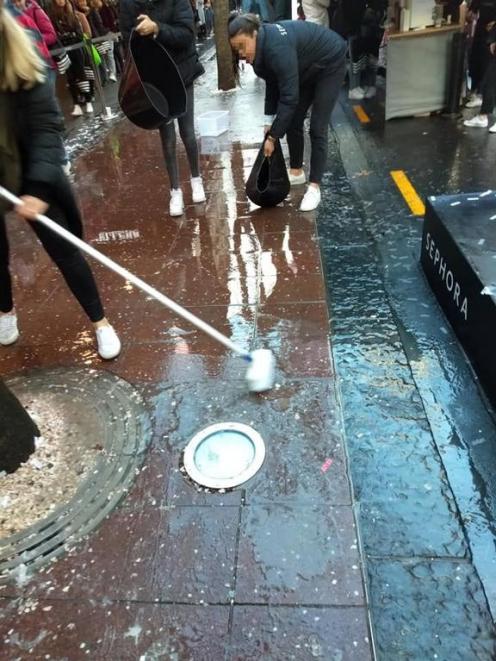 Sephora staff cleaning the area after the store's opening. Photo: Matthew Tukaki via RNZ