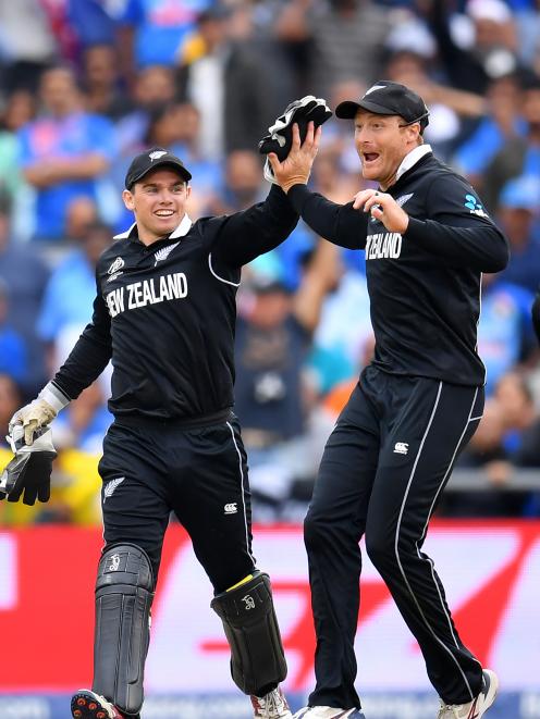 Guptill is congratulated by wicketkeeper Tom Latham. Photo: Getty Images 