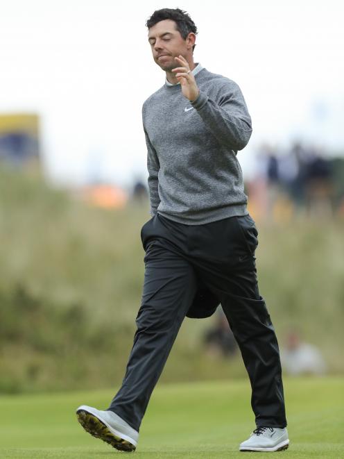 A dejected Rory McIlroy waves to his home crowd after a disastrous opening day left him with too...