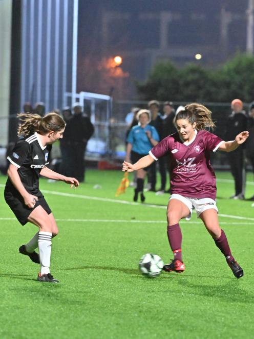 Kate Guildford of Dunedin Tech on the attack against Coastal Spirit's Rebecca Wilson at Logan...