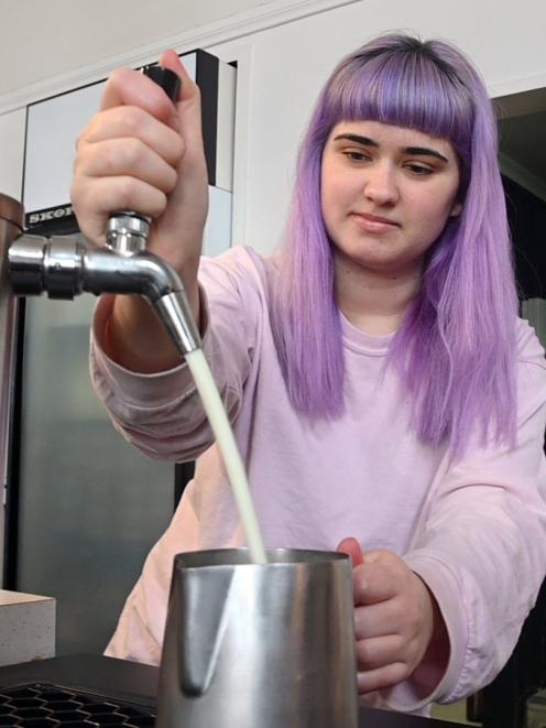 Caitlin Rosalie pours milk from a Spout milk keg at The Corner Store cafe. PHOTO: CRAIG BAXTER