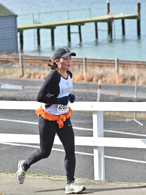 Sue Kim makes her way through St Leonards during the Port Chalmers to Dunedin Road Race on...