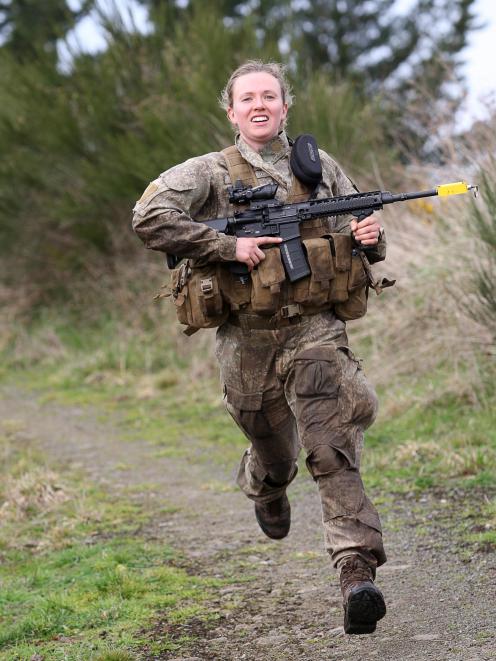 Lance Corporal Kate Downie-Melrose, a Dunedin-based insurance industry manager, races between two...