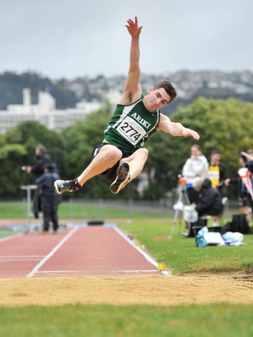 Ariki's Shay Veitch flies through the air during his winning long jump performance at the...